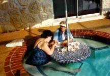 Karen gives Mommy a manicure in the pool.